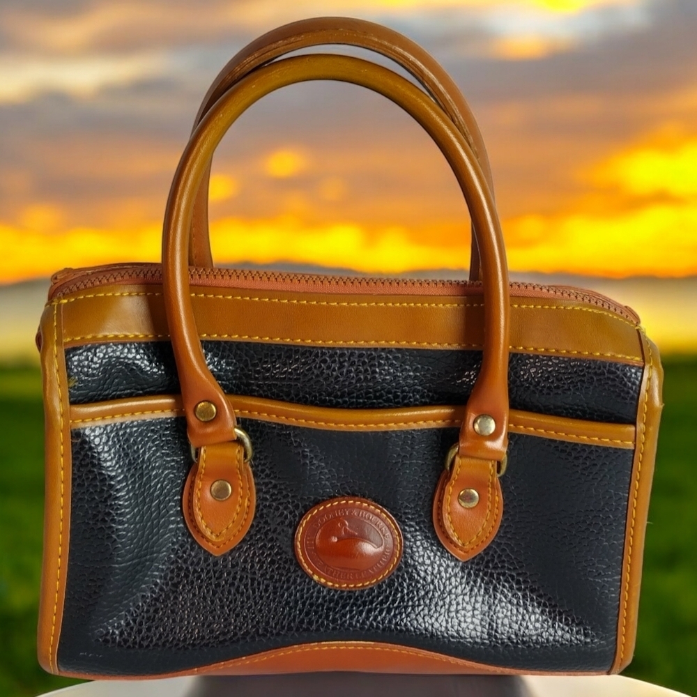 Dooney & Bourke Black and Tan Pebbled Leather Satchel